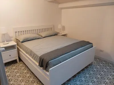 Letto o letti in una camera di Casa Gioconda