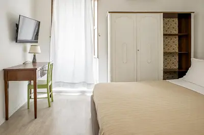 Letto o letti in una camera di Mirabella Apartment in Ortigia by Wonderful Italy