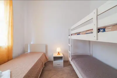 Letto o letti in una camera di Villa Fratelli