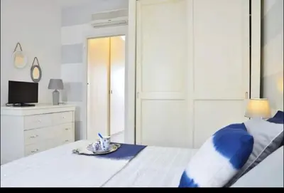 Letto o letti in una camera di Appartamento Borgo Rio Favara