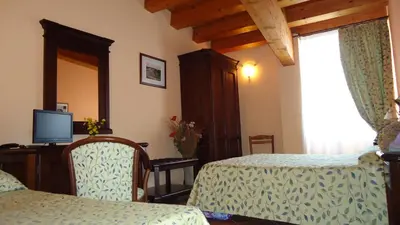 TV o dispositivi per l'intrattenimento presso Hotel Archimede Ortigia