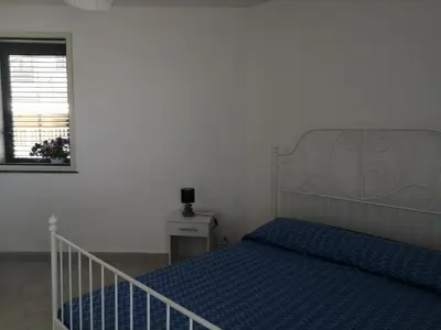 Letto o letti in una camera di CM HOUSE MARZAMEMI