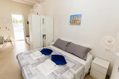 Letto o letti in una camera di Perladelmare