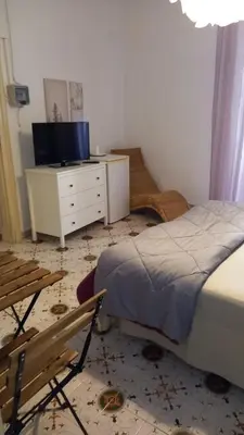 TV o dispositivi per l'intrattenimento presso HomeholidayinSicily - Room ovest