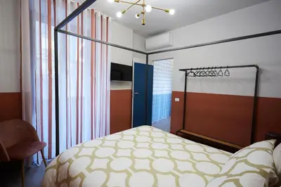 Letto o letti in una camera di KARIZZA HOME