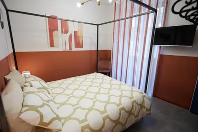Letto o letti in una camera di KARIZZA HOME