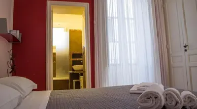 Letto o letti in una camera di casa vacanze L'Altra Diaz