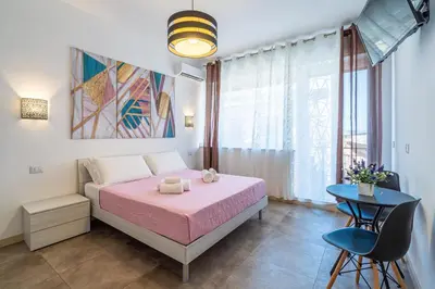 Letto o letti in una camera di Agorà