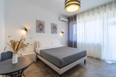 Letto o letti in una camera di Agorà