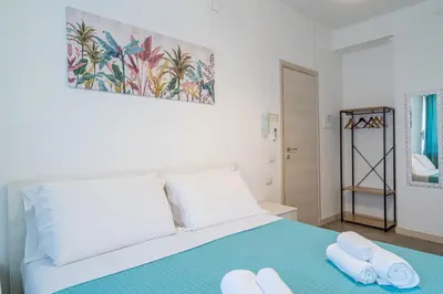 Letto o letti in una camera di Agorà