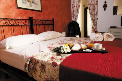 Letto o letti in una camera di B&B Principe Augusta