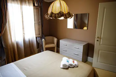 Letto o letti in una camera di B&B Principe Augusta