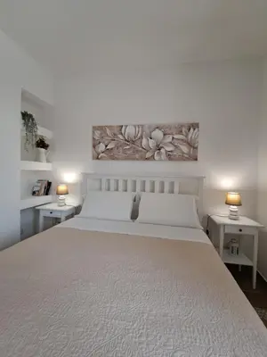 Letto o letti in una camera di Cortile Damar