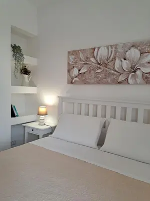 Letto o letti in una camera di Cortile Damar