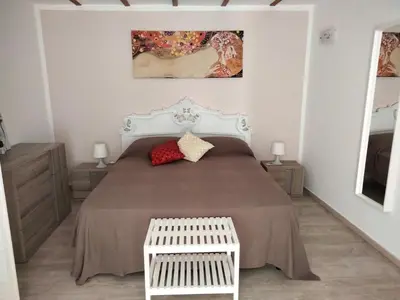 Letto o letti in una camera di Casina al Rettifilo