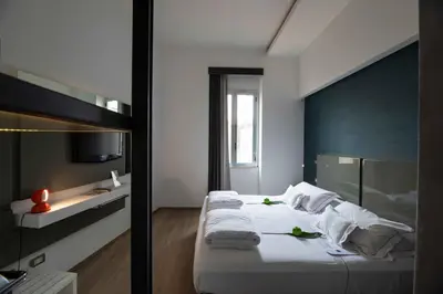 Letto o letti in una camera di UNA Hotels One Siracusa Wellness & SPA