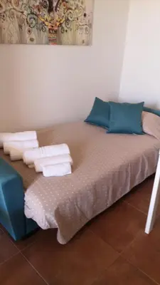 Letto o letti in una camera di VILLA SESIFE Avola