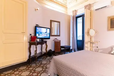 Letto o letti in una camera di Vera Rooms