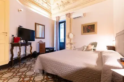 Letto o letti in una camera di Vera Rooms