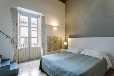 Letto o letti in una camera di B&B Palazzo Del Sale
