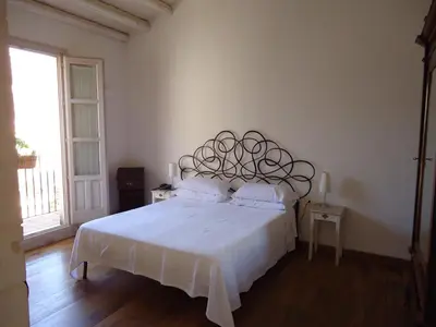 Letto o letti in una camera di B&B Palazzo Del Sale