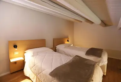 Letto o letti in una camera di ACANTO -Viaggio Barocco