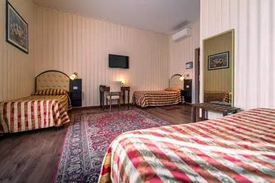Letto o letti in una camera di Hotel Villa Romeo