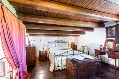 Letto o letti in una camera di Villa Suq