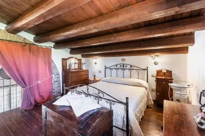 Letto o letti in una camera di Villa Suq