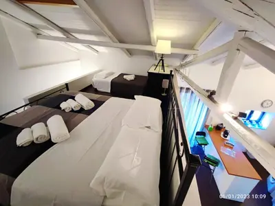 Letto o letti in una camera di DOMUS COPPOLA CATANIA Apartments
