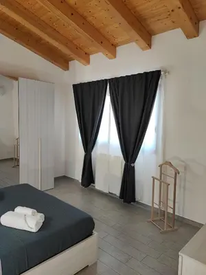 Letto o letti in una camera di Borgellusa House Luigi
