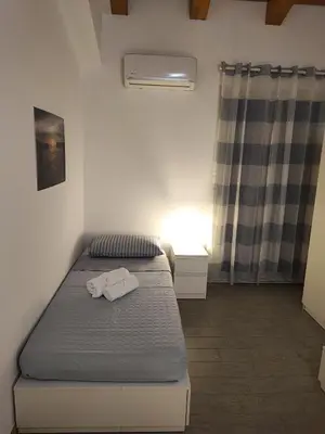 Letto o letti in una camera di Borgellusa House Luigi