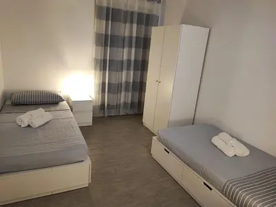 Letto o letti in una camera di Borgellusa House Luigi
