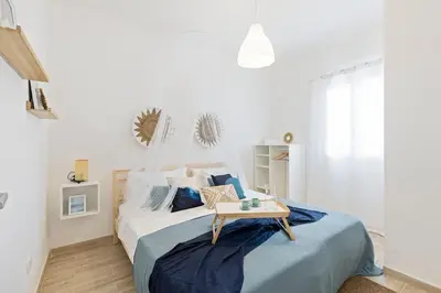 Letto o letti in una camera di Casa un Tocco di Blu con piscina privata