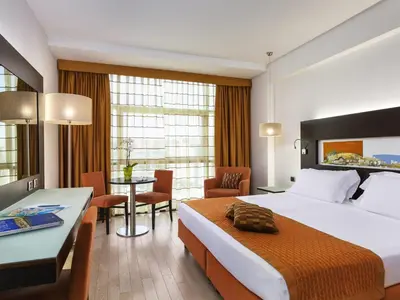 Letto o letti in una camera di Hotel Mercure Siracusa