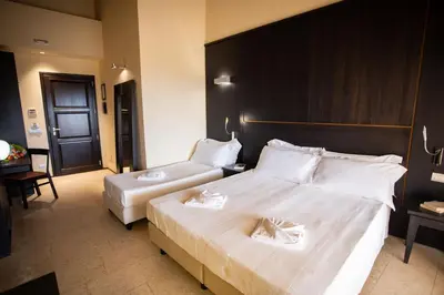 Letto o letti in una camera di Cambiocavallo Resort