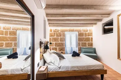 Letto o letti in una camera di Othila Home