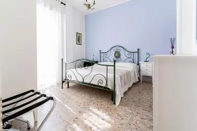 Letto o letti in una camera di Casa Sofocle comodo bivani in borgata a due passi da Ortigia senza i disagi i Ortigia