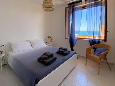 Letto o letti in una camera di Jerry Beach house
