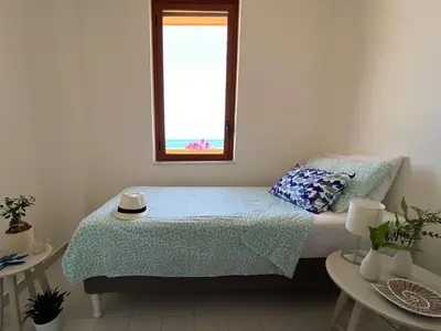 Letto o letti in una camera di Jerry Beach house