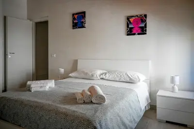 Letto o letti in una camera di Nonna Nata