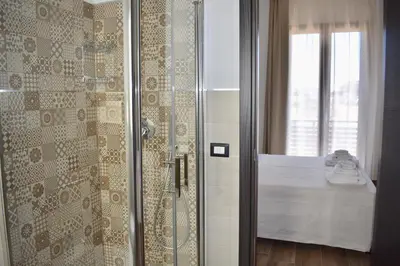 Letto o letti in una camera di Domus Solis