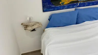 Letto o letti in una camera di Delizioso appartamento a ridosso del mare del Plemmirio Siracusa