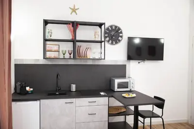 Cucina o angolo cottura di Il rifugio in Borgata suite moderna vicino Ortigia e al mare