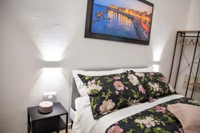 Letto o letti in una camera di Il rifugio in Borgata suite moderna vicino Ortigia e al mare
