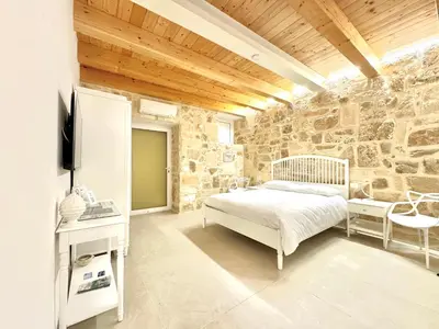 Letto o letti in una camera di Amurusa Room