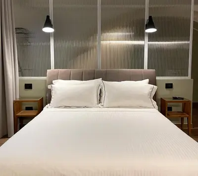 Letto o letti in una camera di Raha Suites