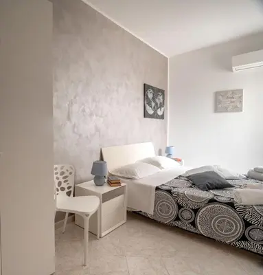 Letto o letti in una camera di A casa tua Affitti brevi