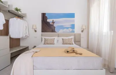 Letto o letti in una camera di Palazzo Amalfitania