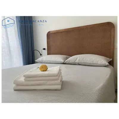Letto o letti in una camera di Rifugio dei due mari Appartamenti Scirocco Levante Ponente